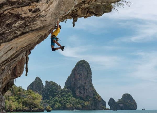 Is Rock Climbing a Sport hanging from cliff